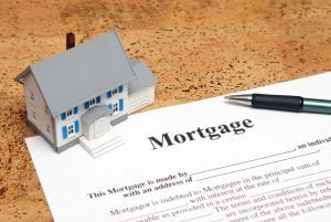 Mortgage contract and home. Protect yourself from mortgage relief scams designed to prey on homeowners in financial distress.